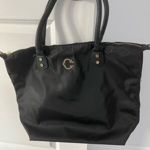 C. Wonder Black Tote Bag with Gold Accents